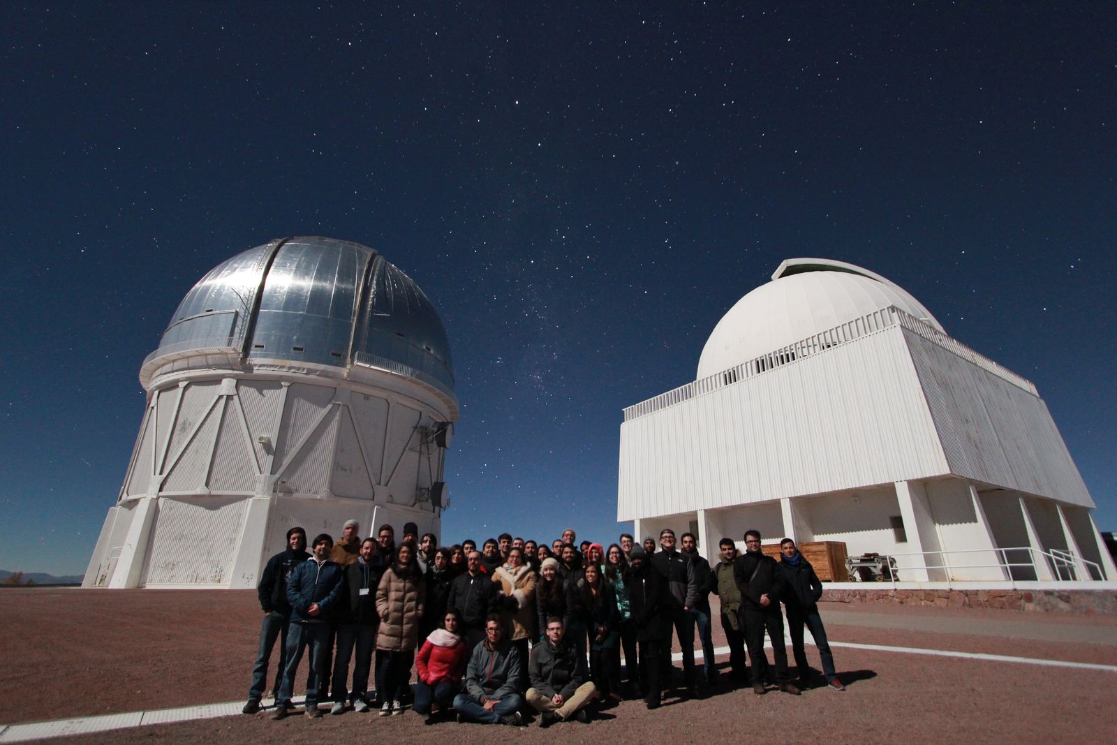 Students in front of telescopes at Cerro Tololo